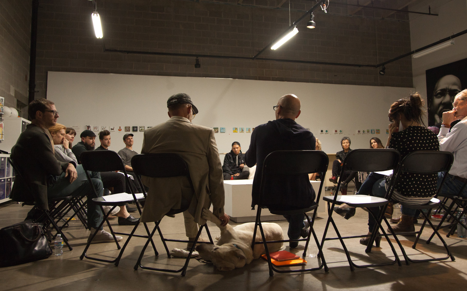 circle of chairs filled with people talking